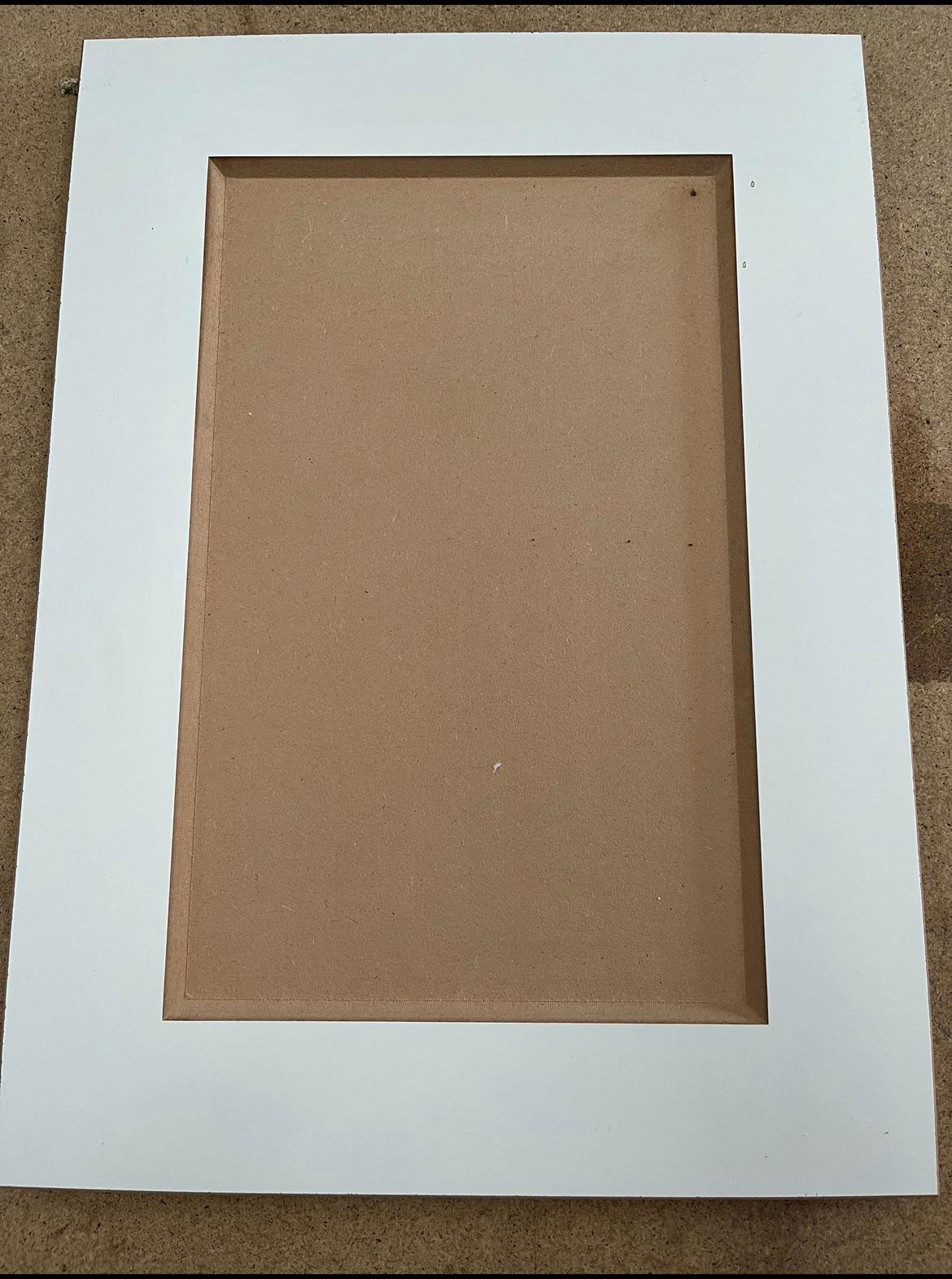 Custom white shaker style cabinet door with four raised panels