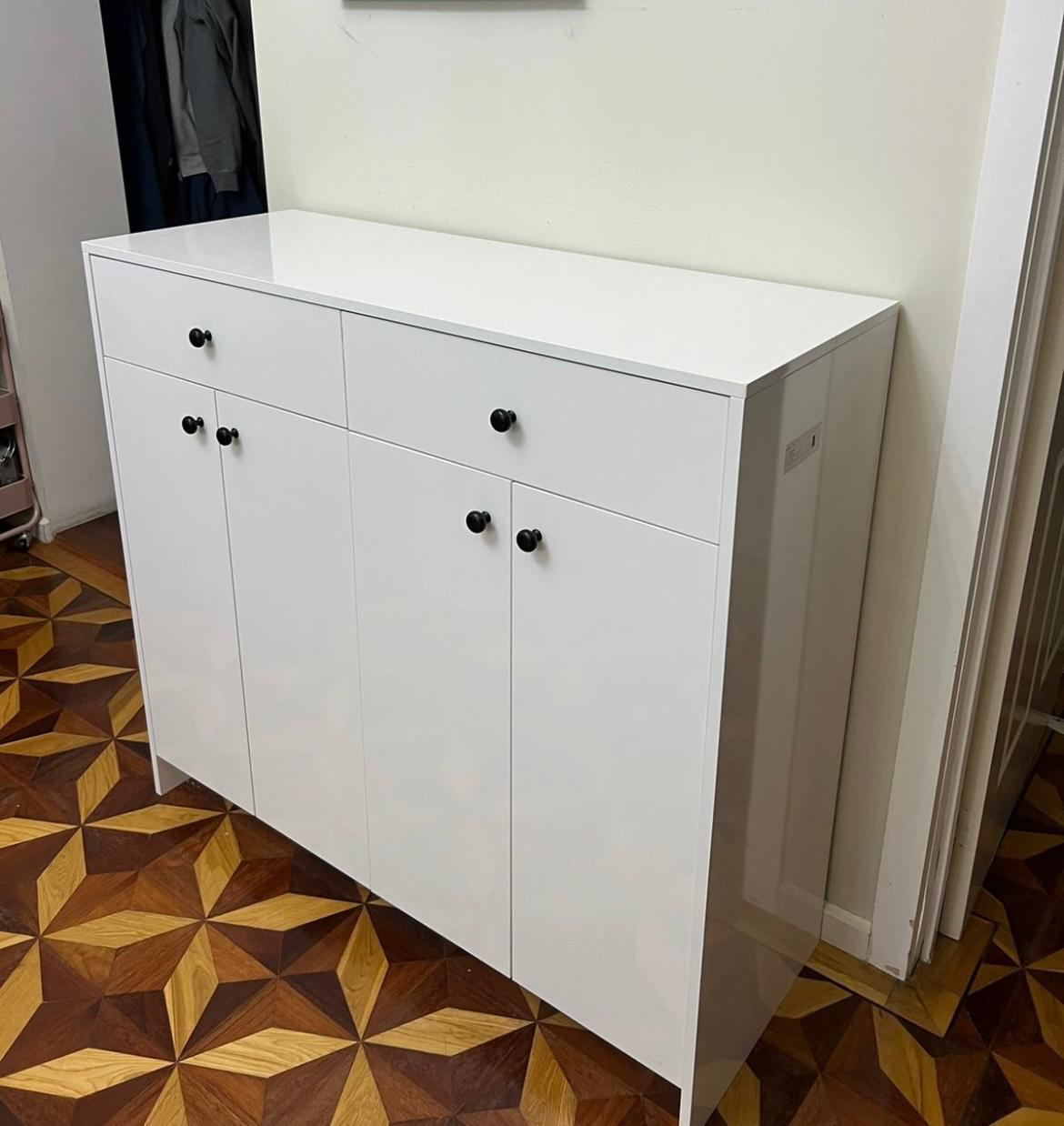 White cabinetry unit suited to a laundry or vanity space