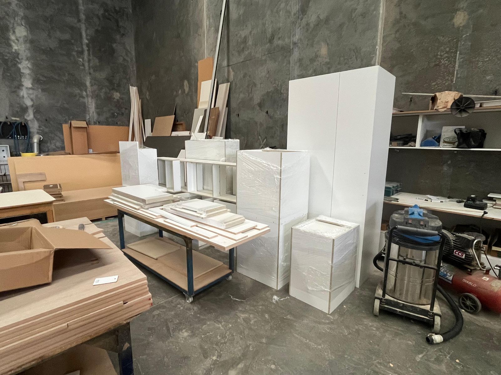 Inside the Oktay Cabinets workshop in Campbellfield with cabinet boxes ready for dispatch