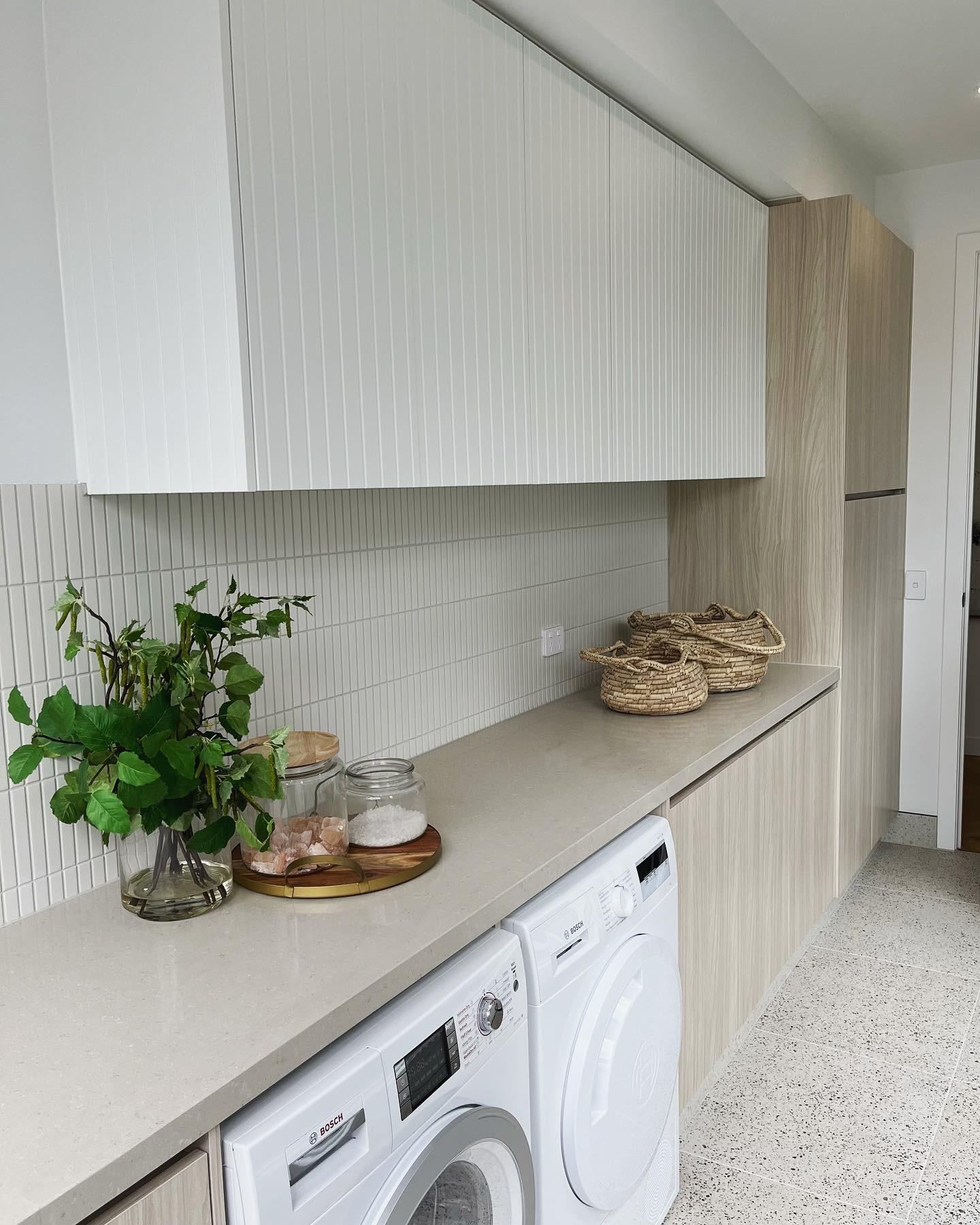 Laundry cabinetry with integrated washing machine