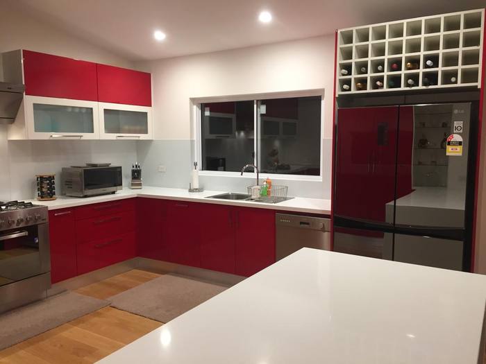 Red gloss kitchen with island bench