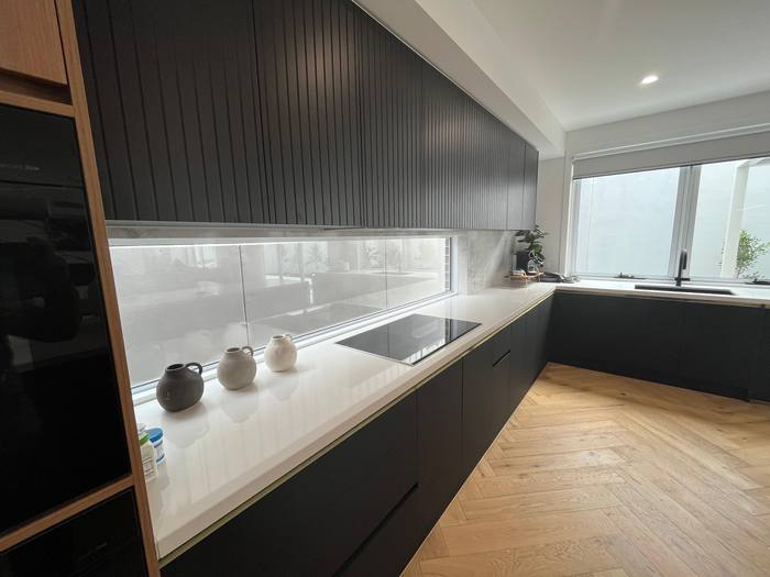 Black kitchen with marble island, close detail