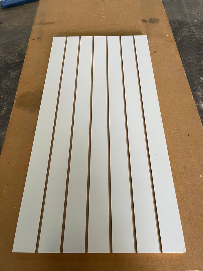 CNC-cut timber slat panels ready for flat pack assembly