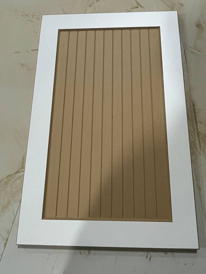 Beige panelled door with vertical grooves