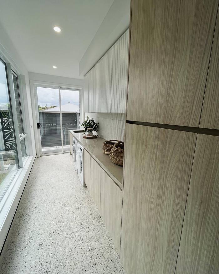 Built-in timber-veneer wardrobe and storage cabinetry